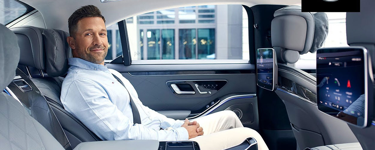 Client enjoying a comfortable journey with Cars Executive's chauffeur service in Surrey